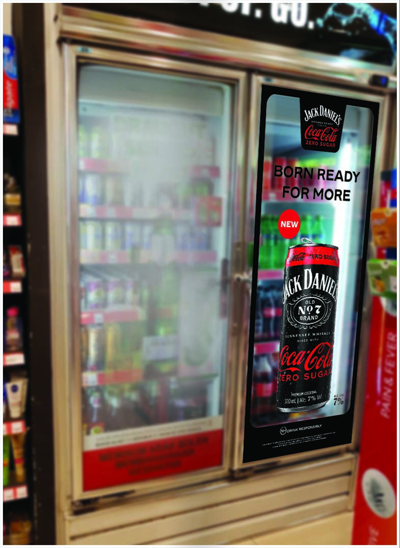 Born Ready fridge door decal applied to a convenience store cooler door, shown in situ beside the shelves it sits next to