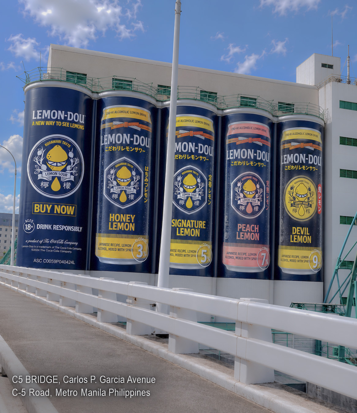 Lemon-Dou building billboard installed on the C5 Bridge along Carlos P. Garcia Avenue in Metro Manila, wrapping five story-tall can-shaped silos